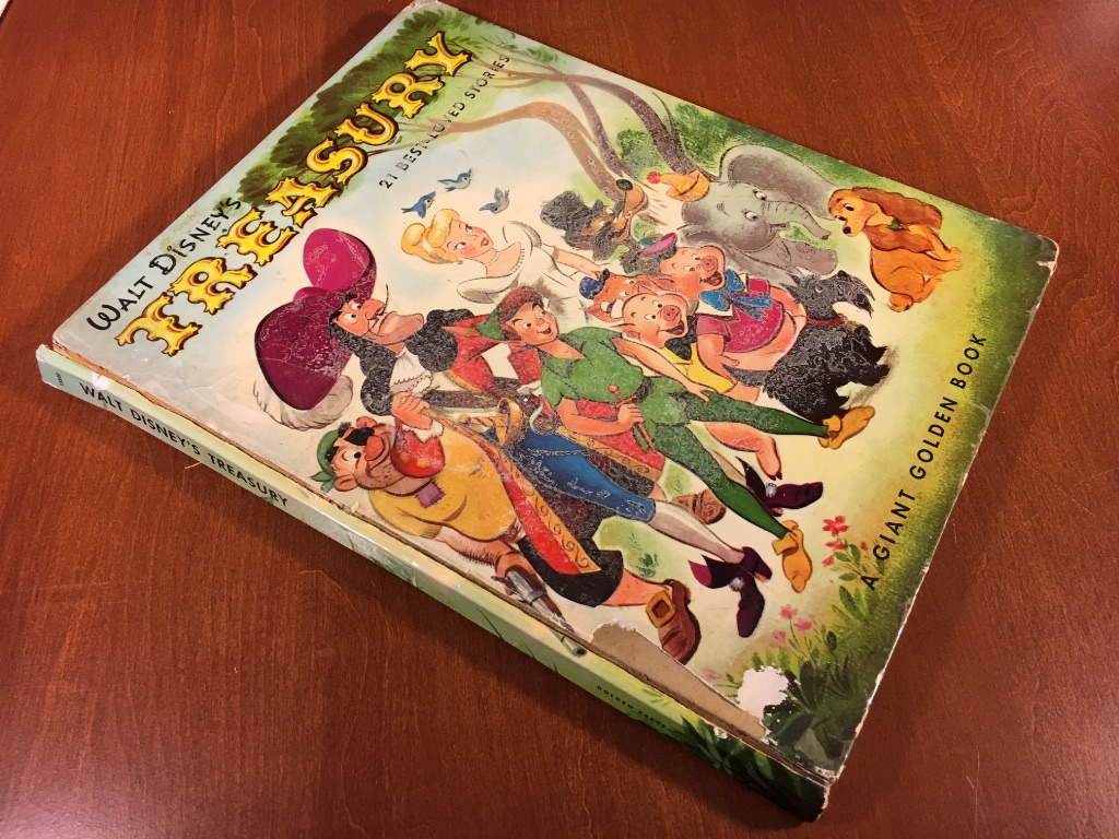 Walt offers Disney's Treasury 21 Best-loved Stories